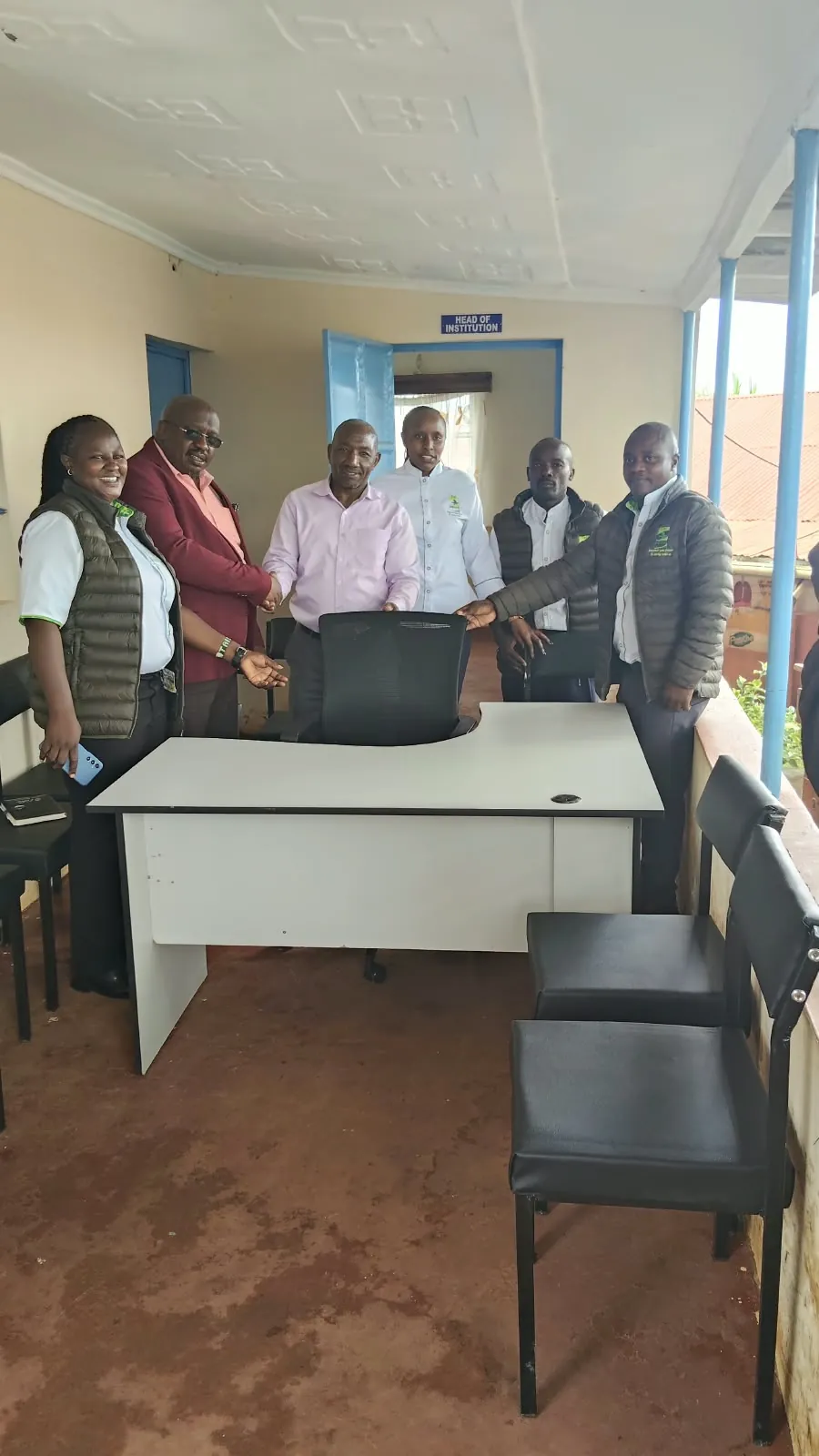 Tai Sacco staff and school leaders in a newly furnished school office