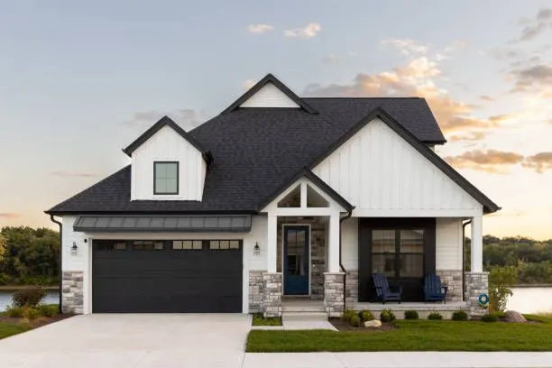 A newly built family home with a garage and front porch